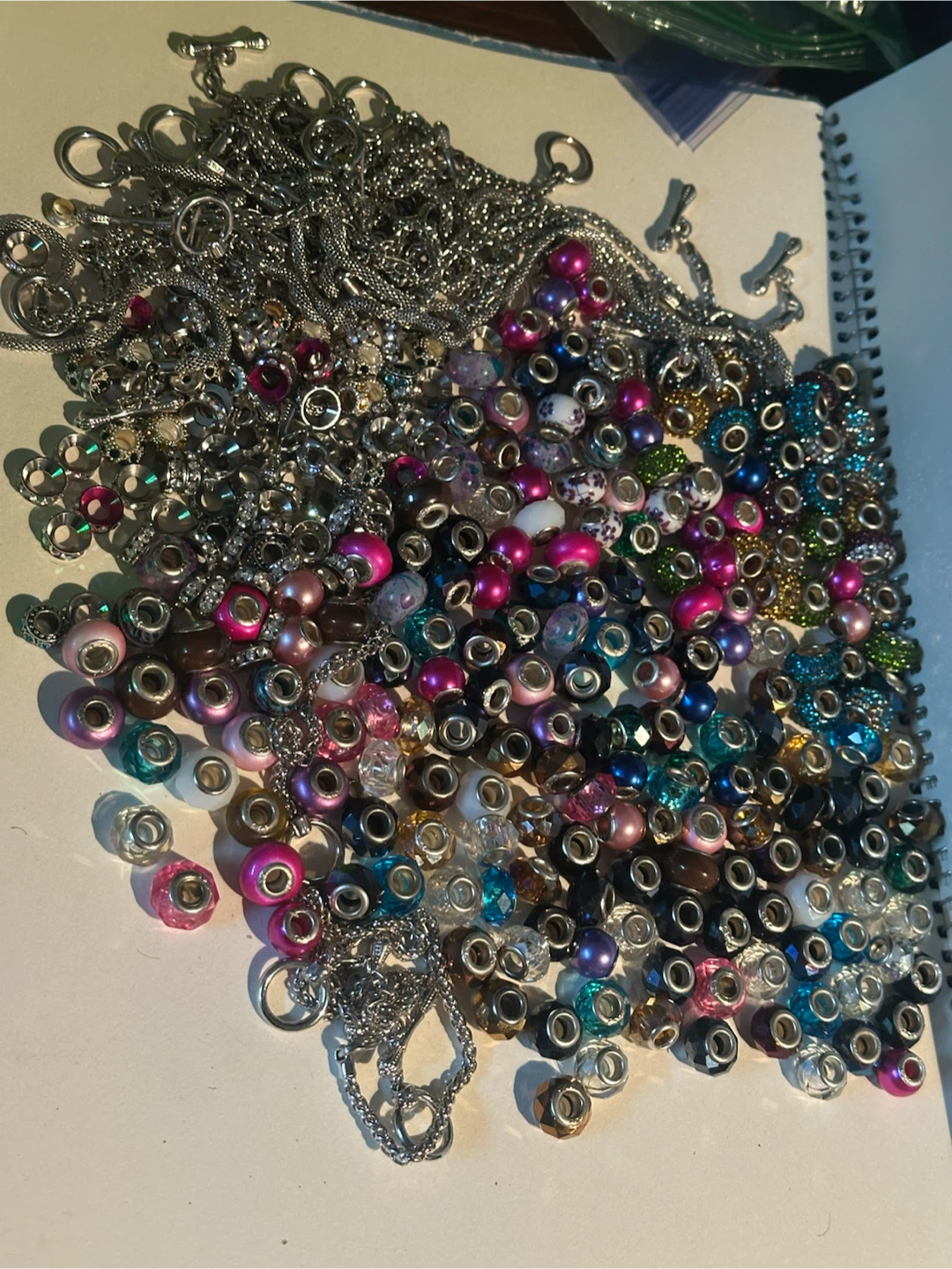 Huge pile of glass charms and bracelets