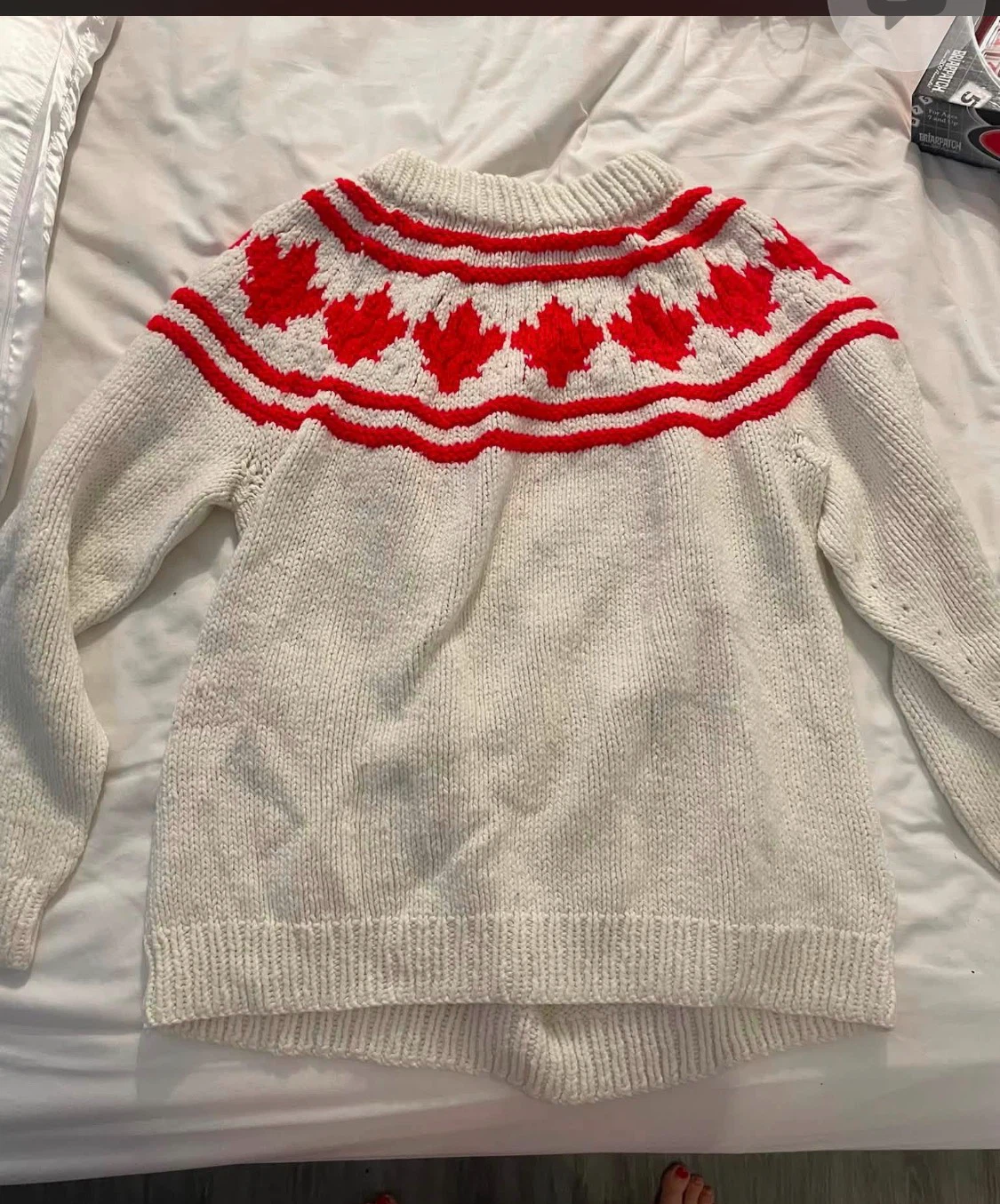 White Sweater with Red Maple Leaf Design