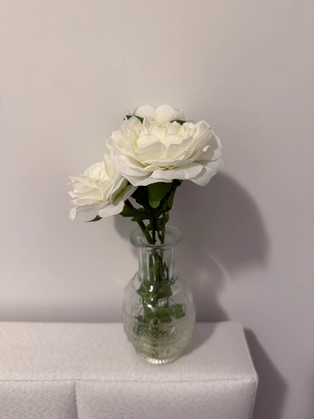 Home Decor: White artificial flowers in glass vase