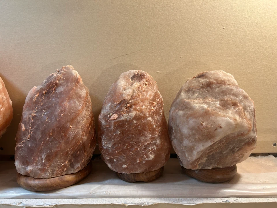 Himalayan salt lamp with wooden base