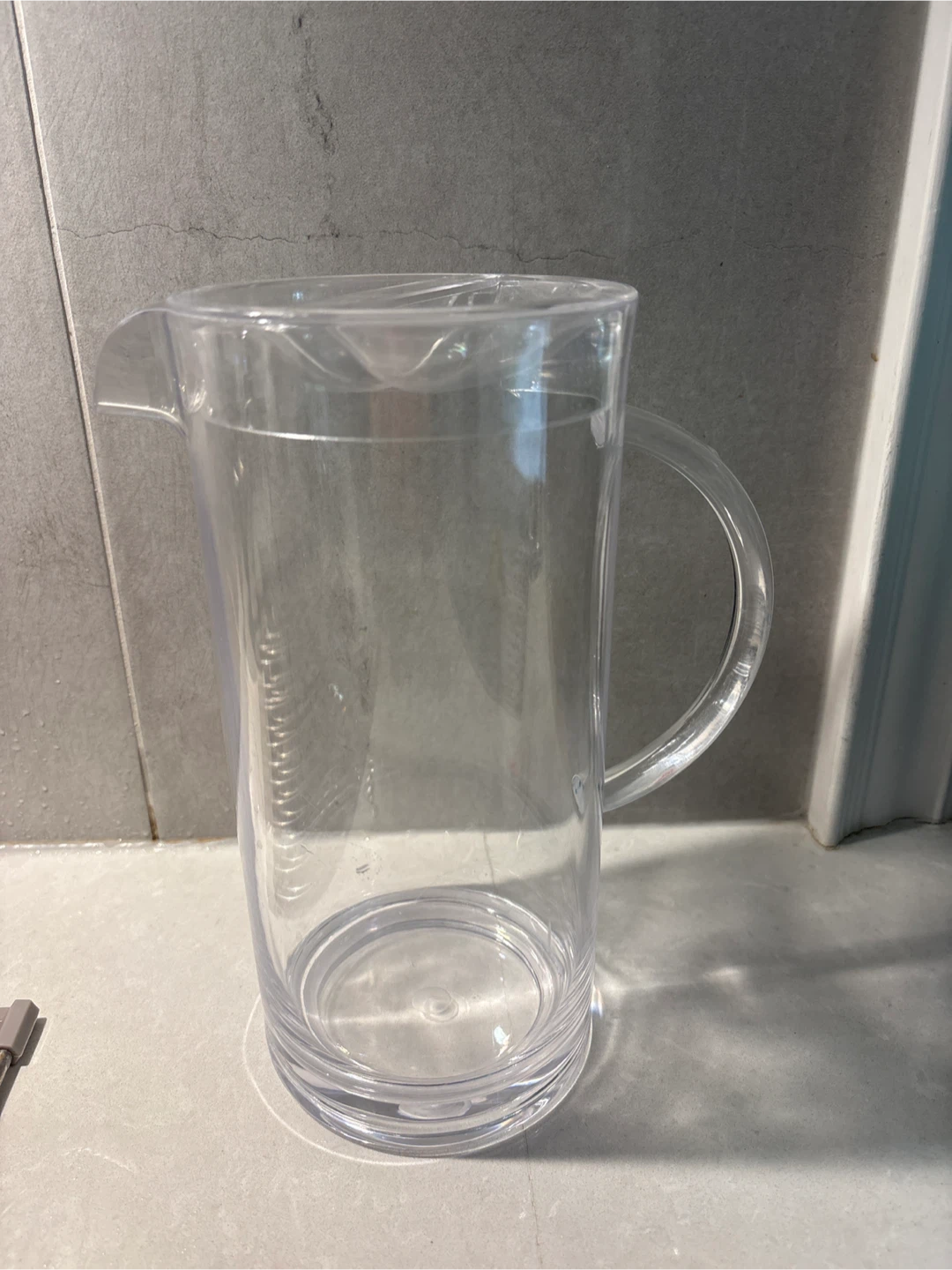 Clear plastic pitcher with lid