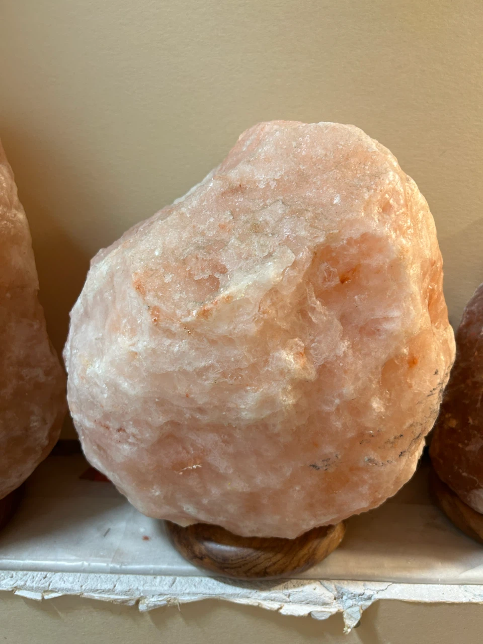 Himalayan salt lamp with wooden base