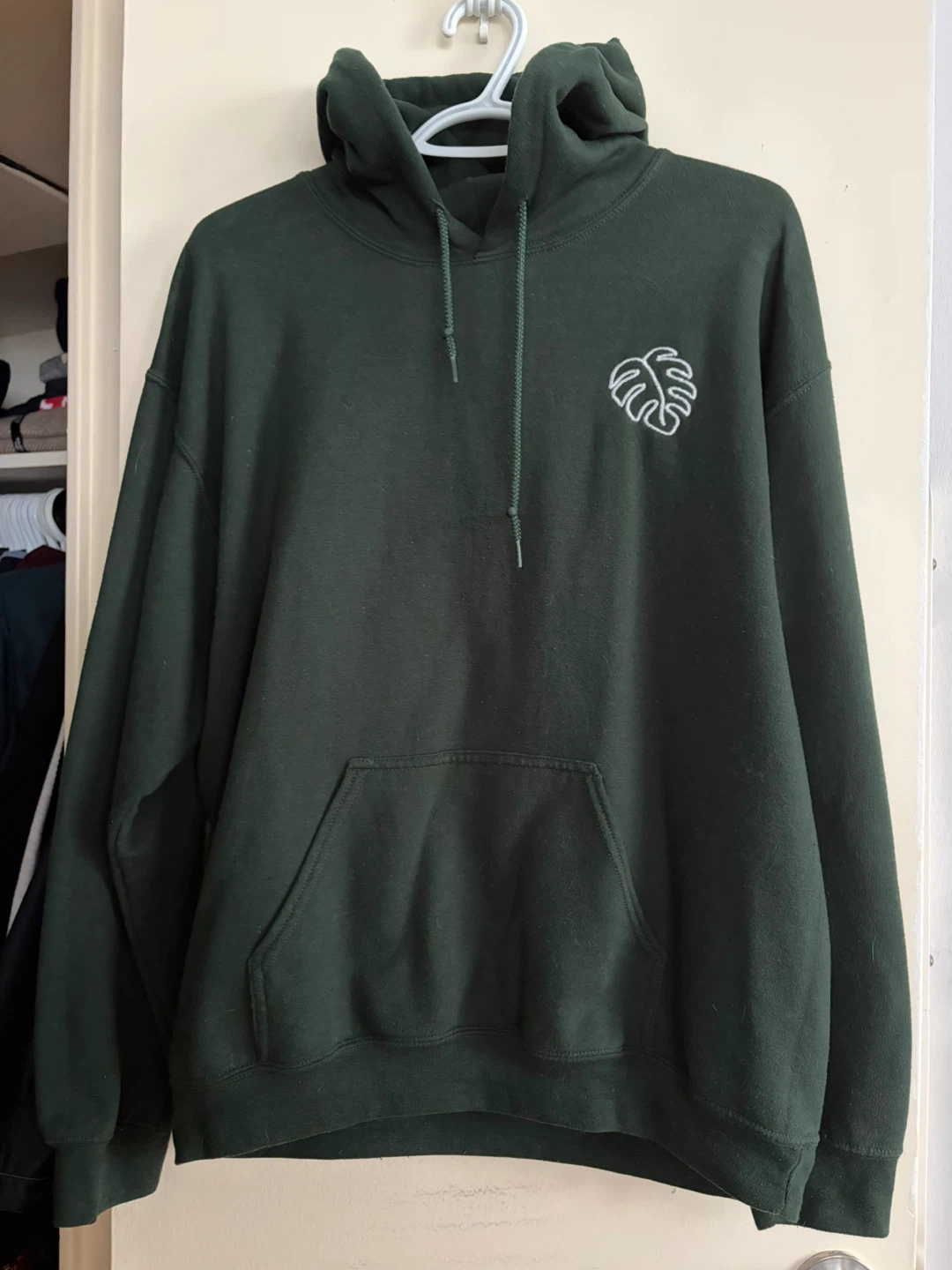 Green hoodie with monstera leaf