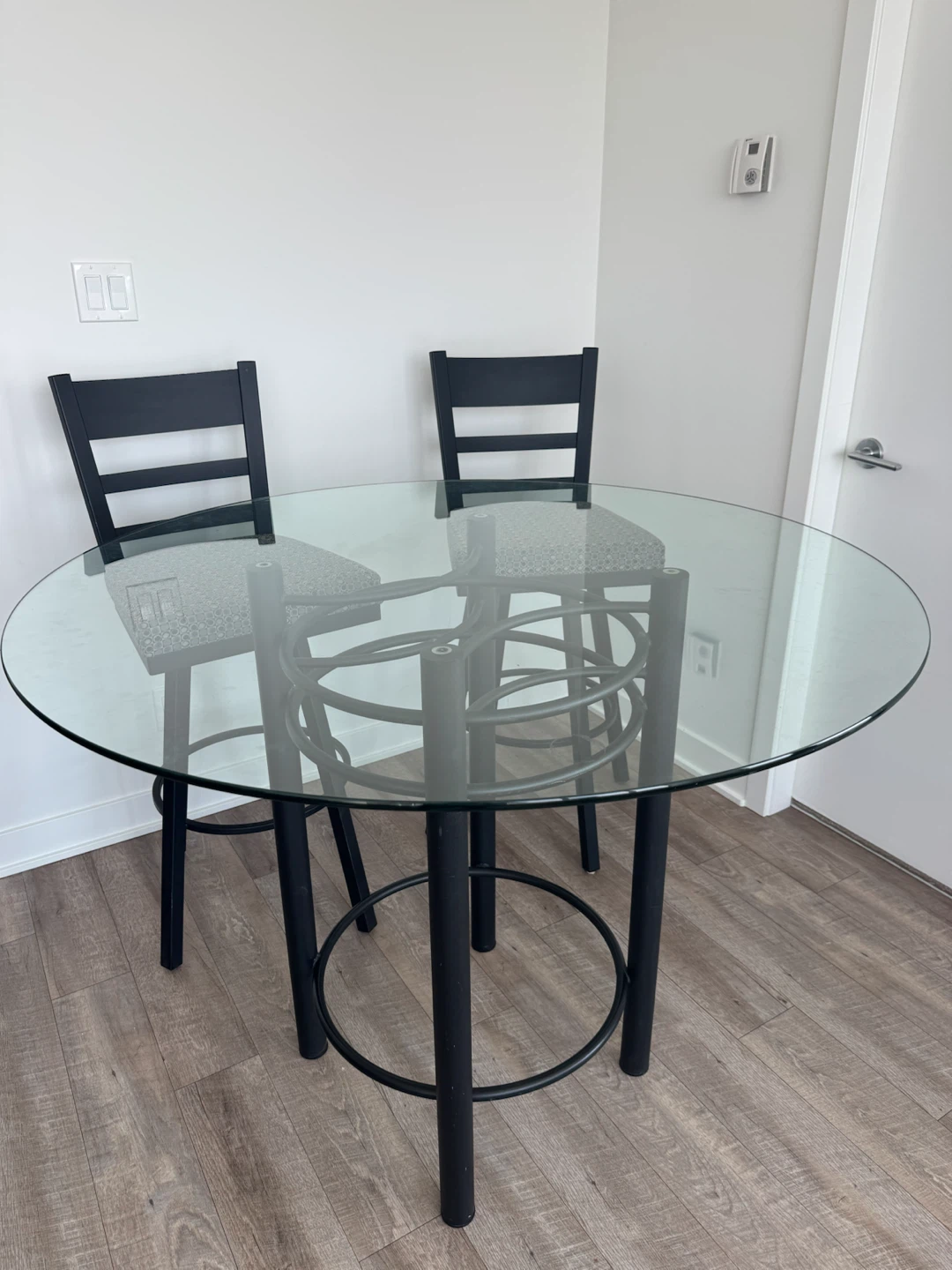 Glass top bar table with 4 stools