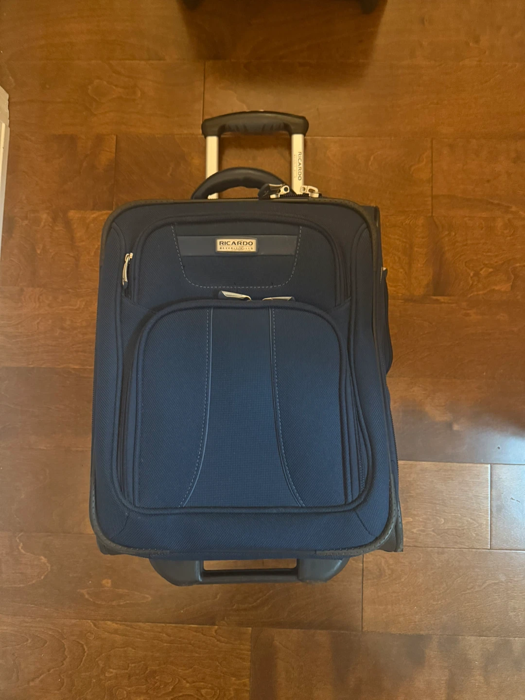 Ricardo Rolling Carry-On Suitcase
