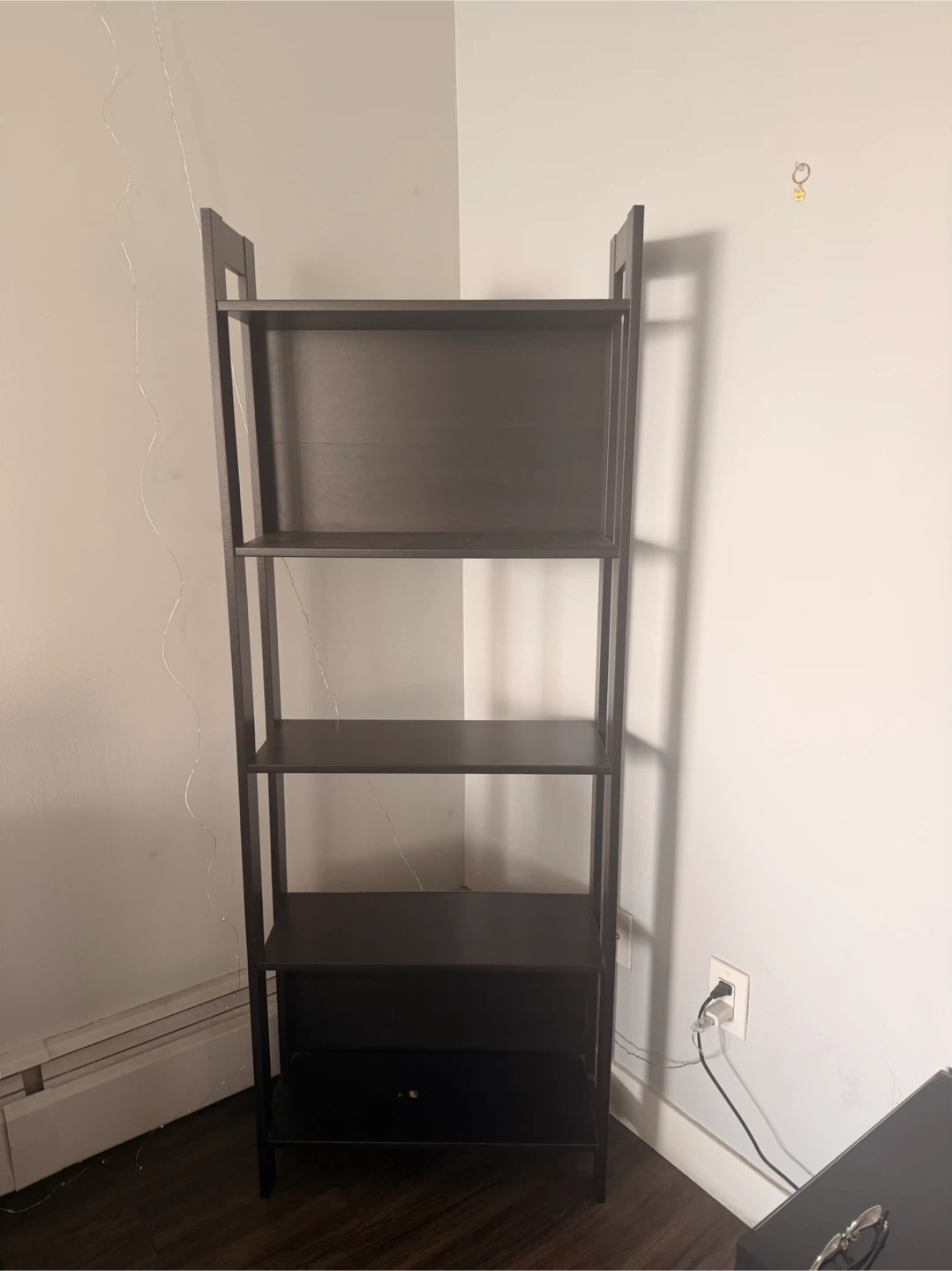 Dark brown four-shelf ladder bookcase