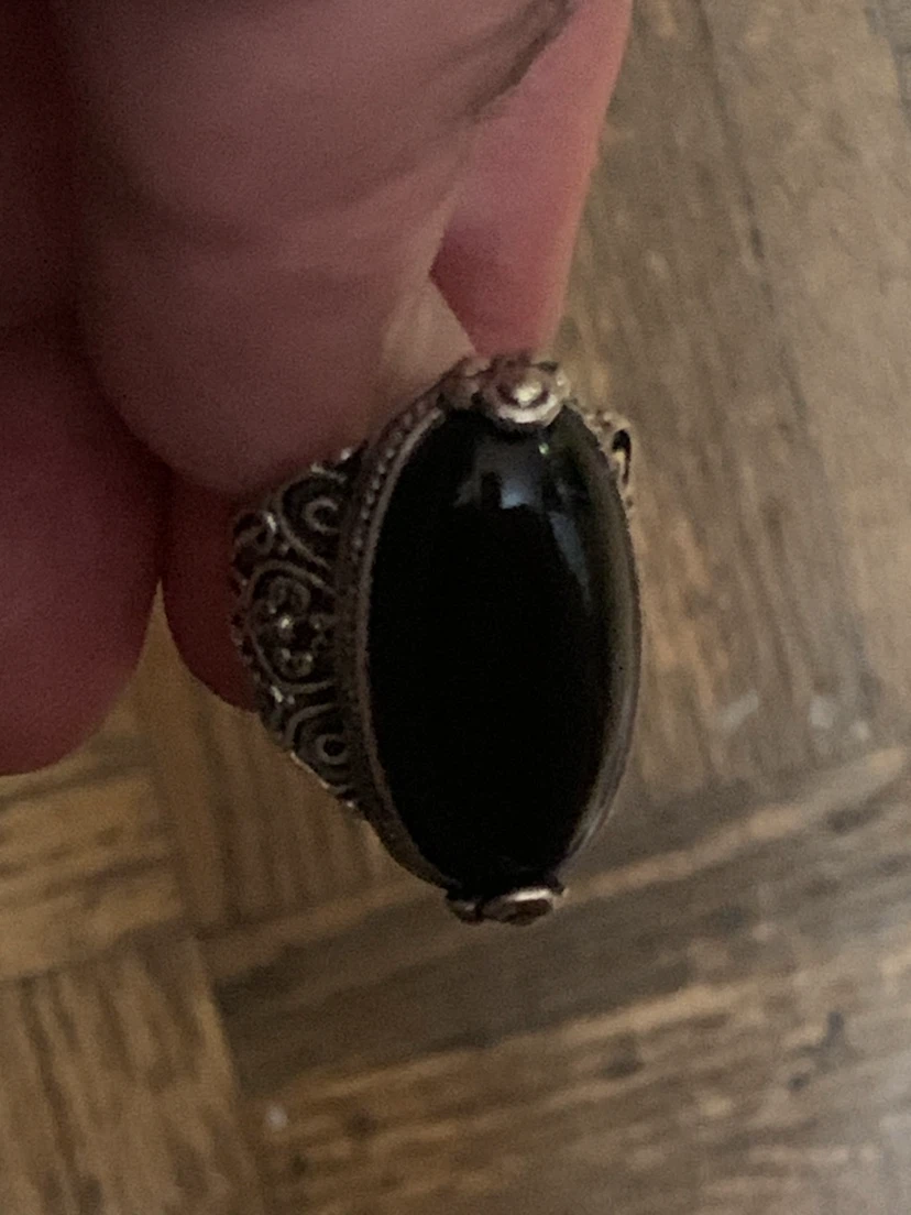 Silver-coloured oval black stone ring