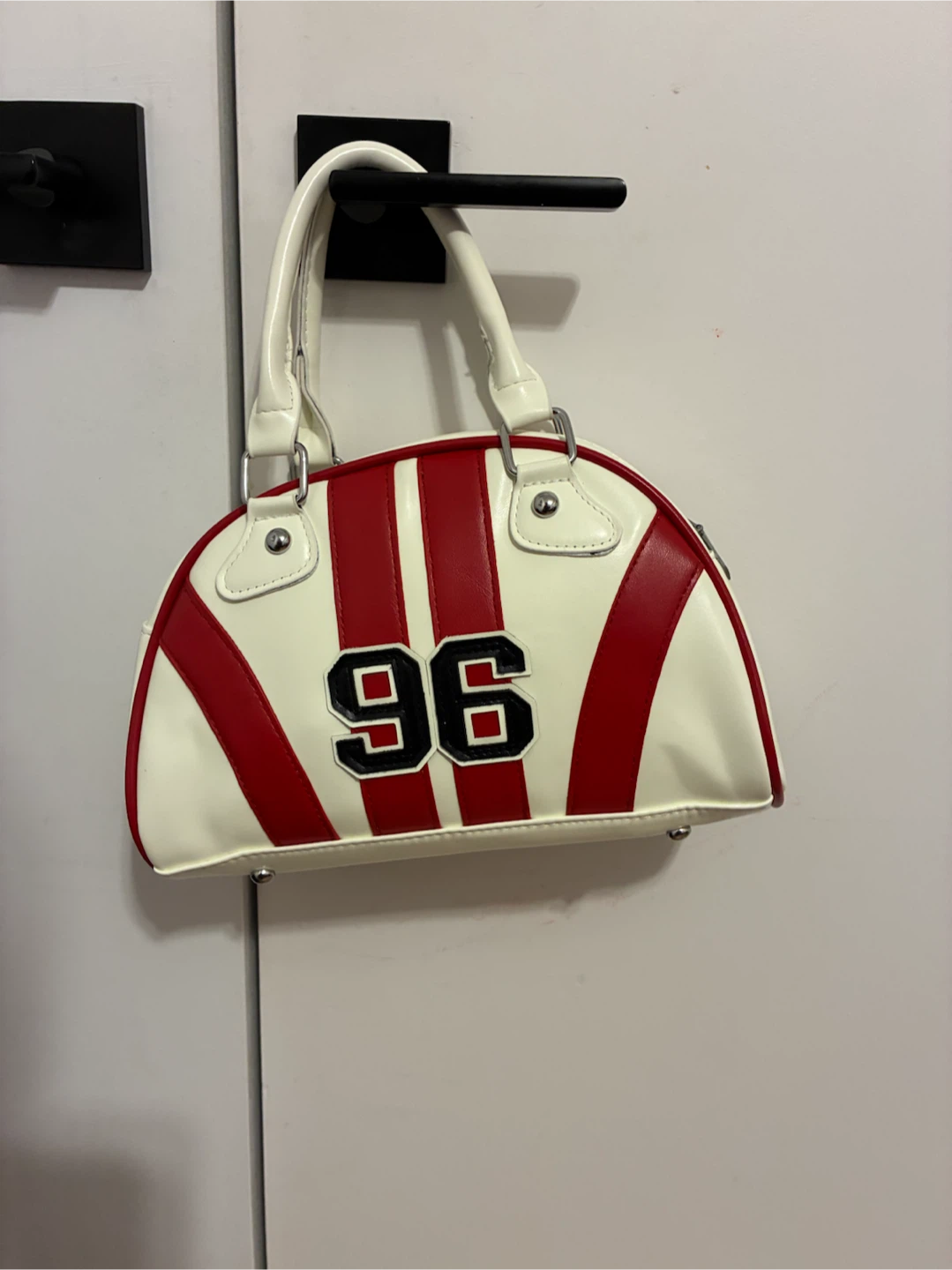 Cream and red hand bag
