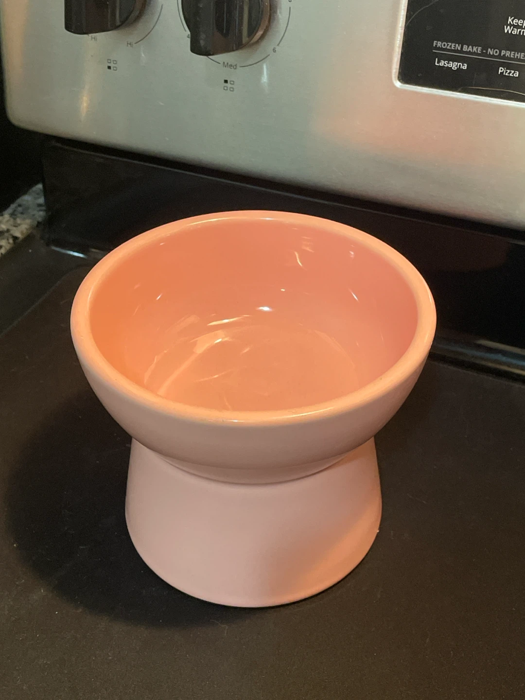 Pink ceramic elevated pet bowl for cat or dog