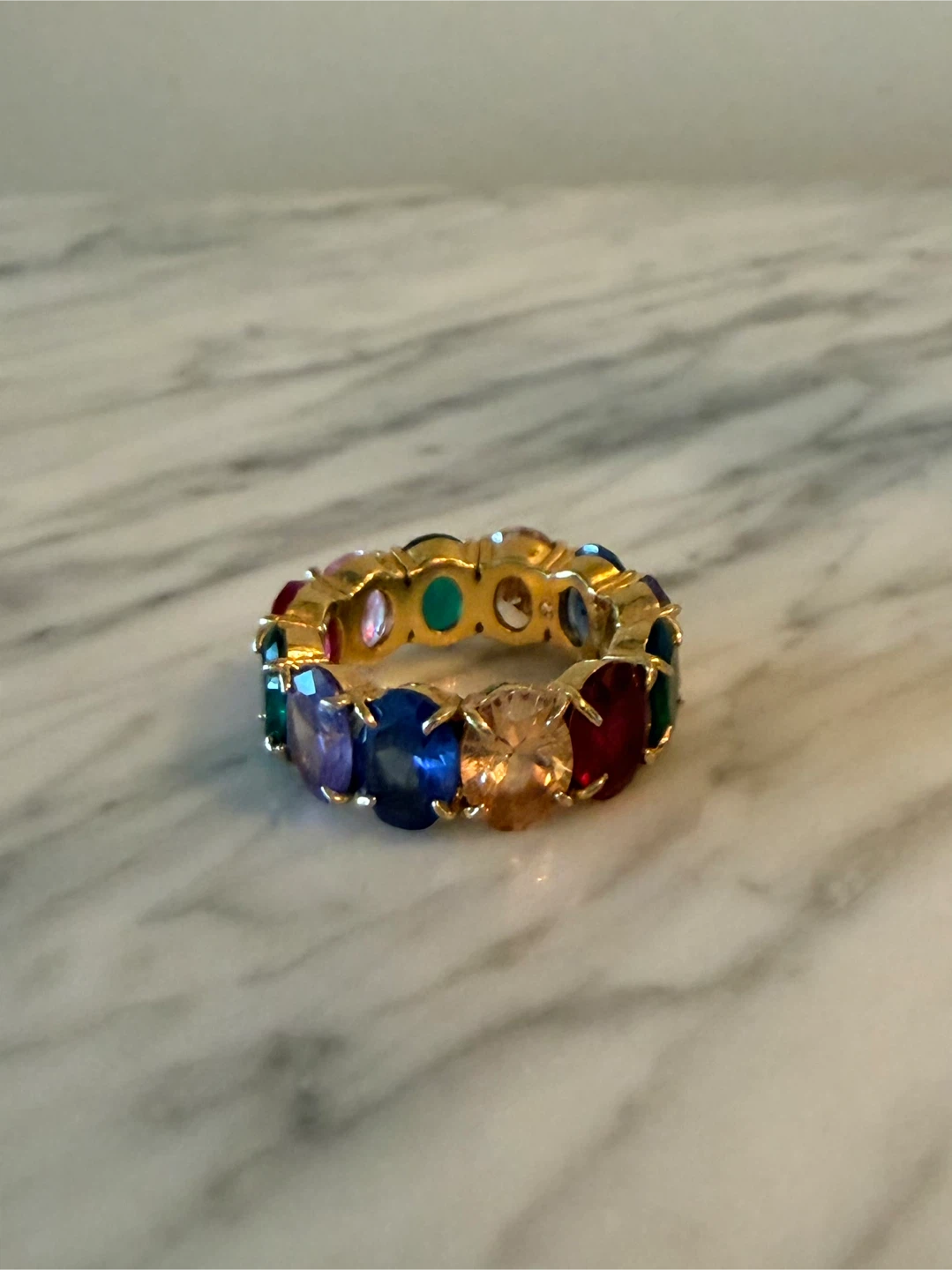 Gold-tone eternity ring with multi-coloured stones