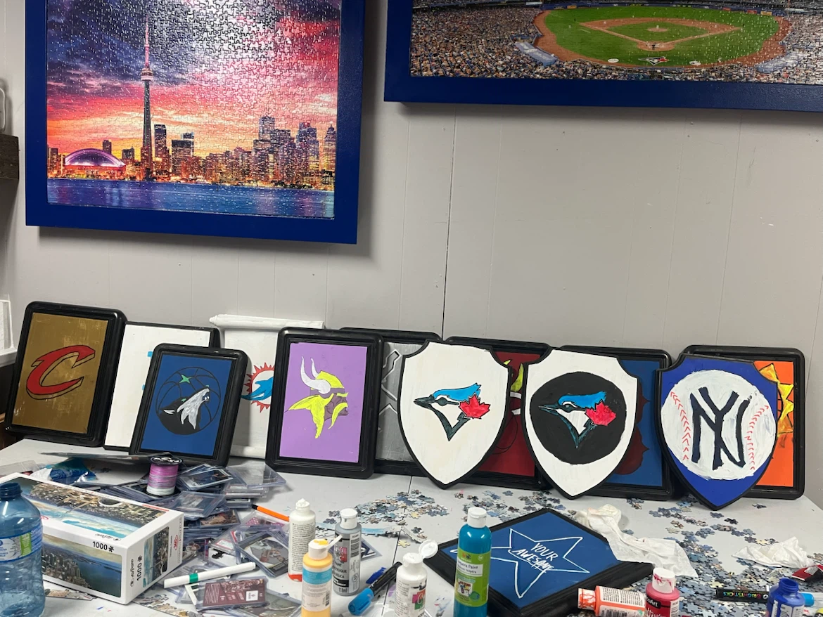 Hand painted sports team logo plaques