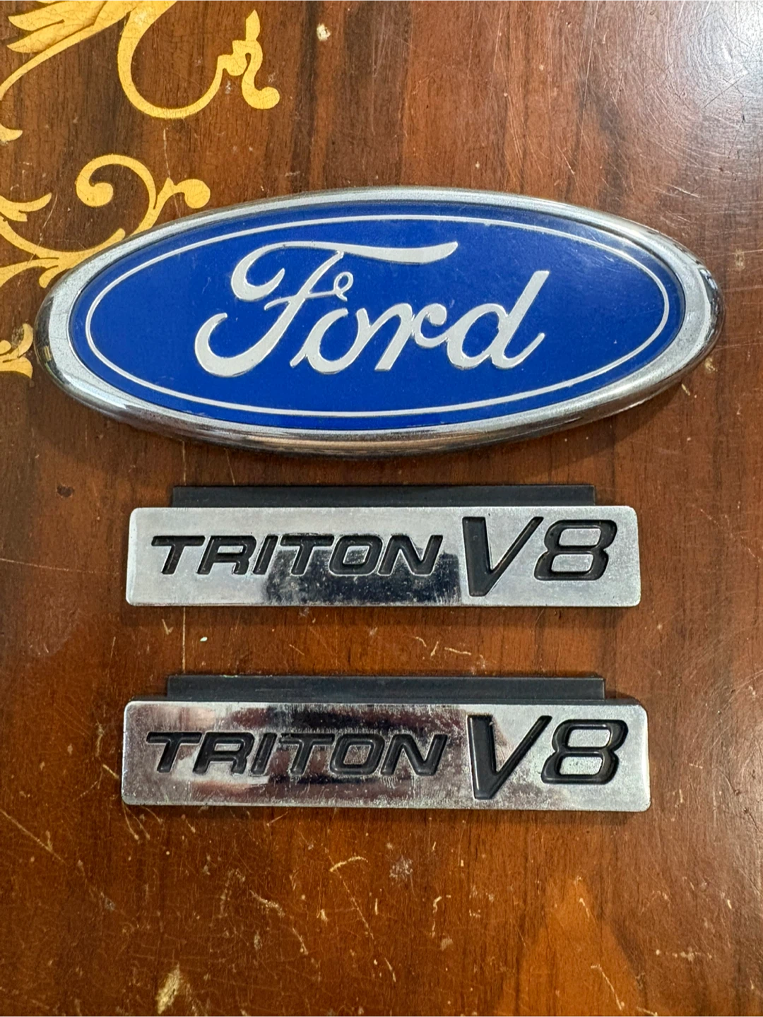 Ford and Triton V8 vehicle emblems