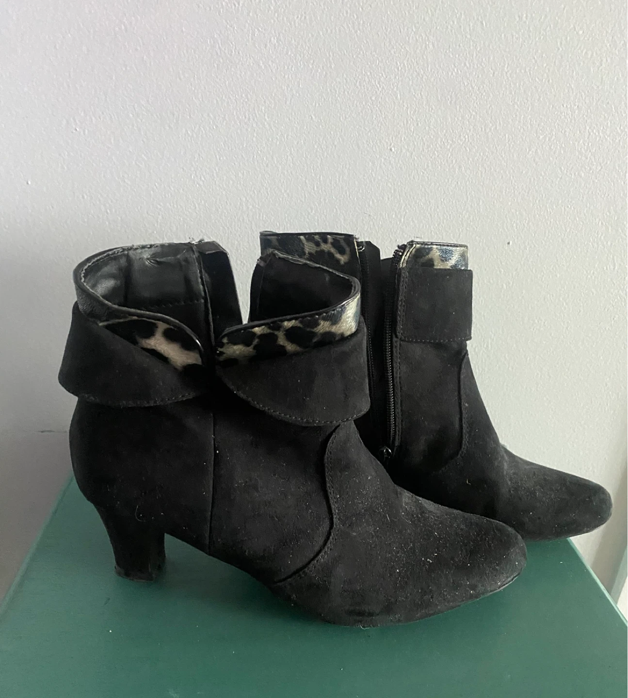 Black ankle boots with leopard print trim