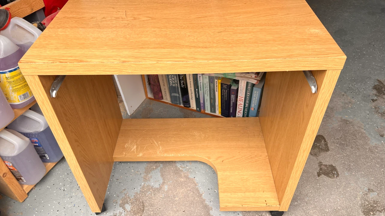 Oak finish compact rolling computer desk