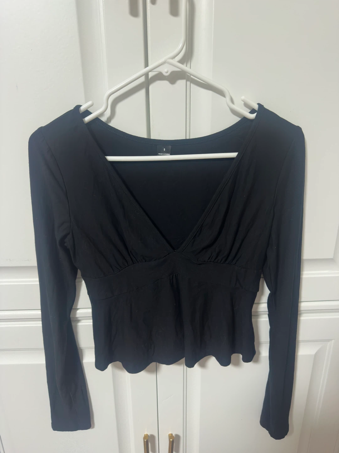 Peplum Black long-sleeve V-neck top