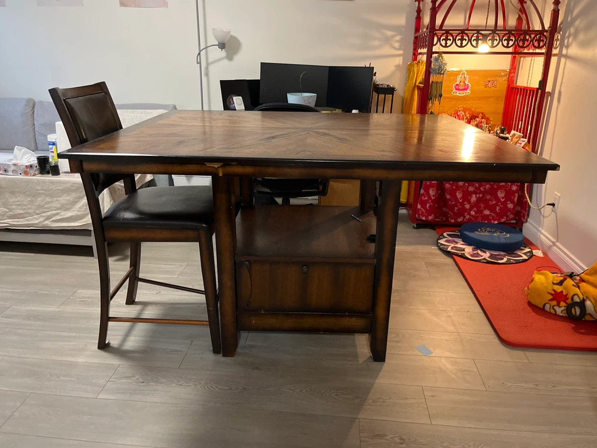 Dark wood counter height dining table with chair