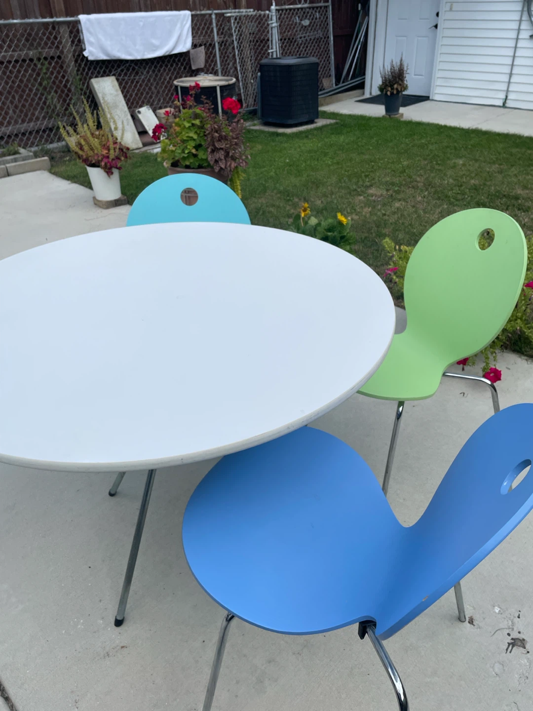 Round White Table with 4 Colorful Chairs