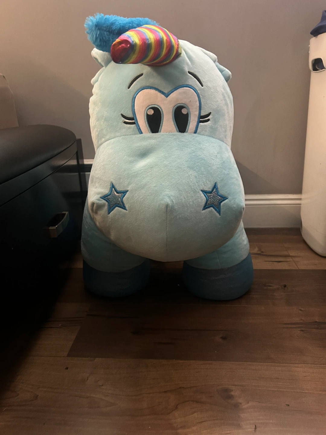 Large blue plush unicorn toy