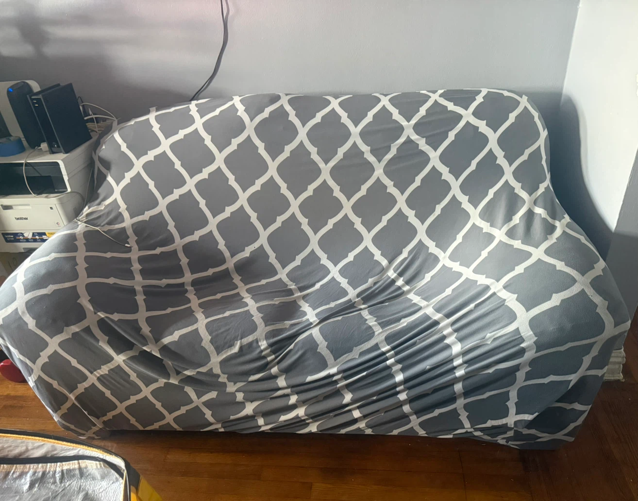 Gray and white trellis pattern sofa slipcover