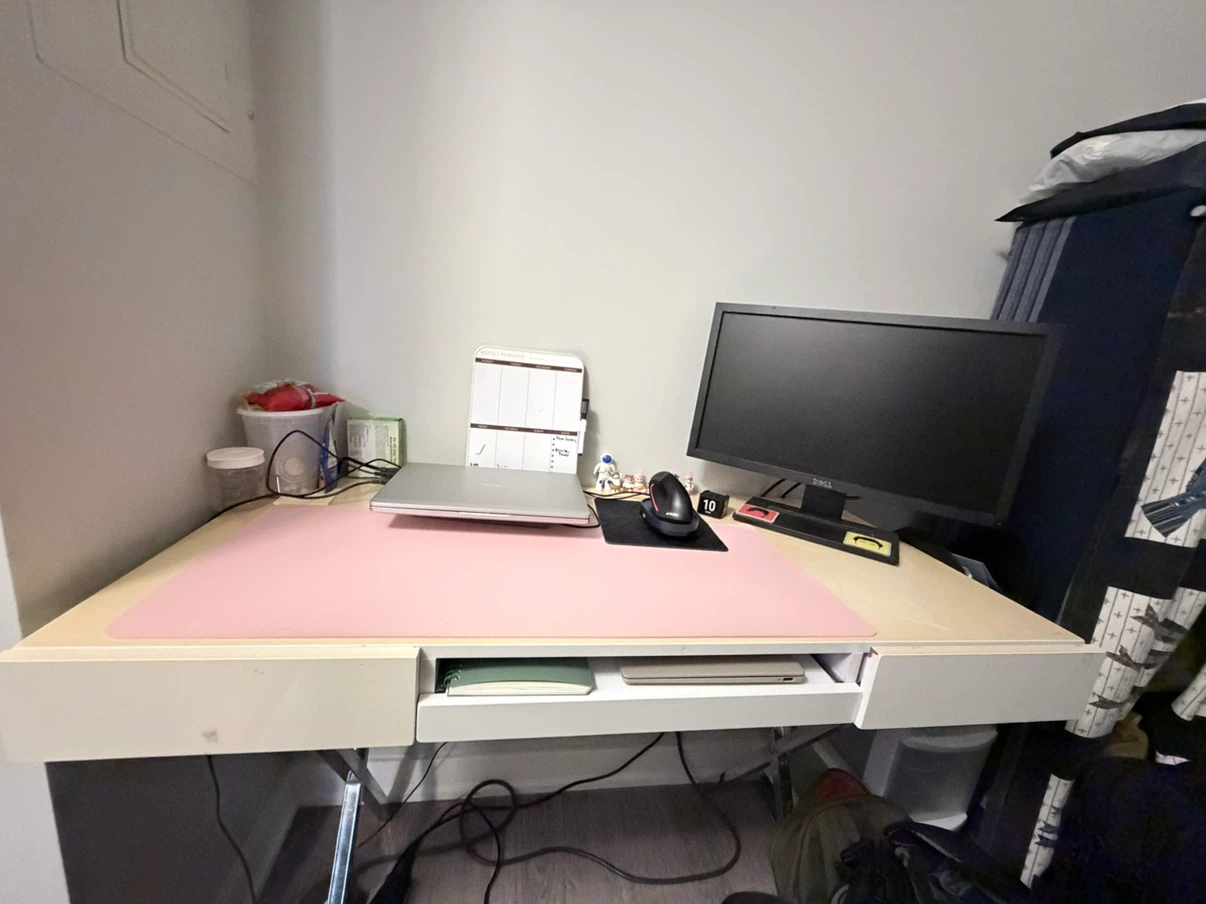 Desk with drawers and pink mat