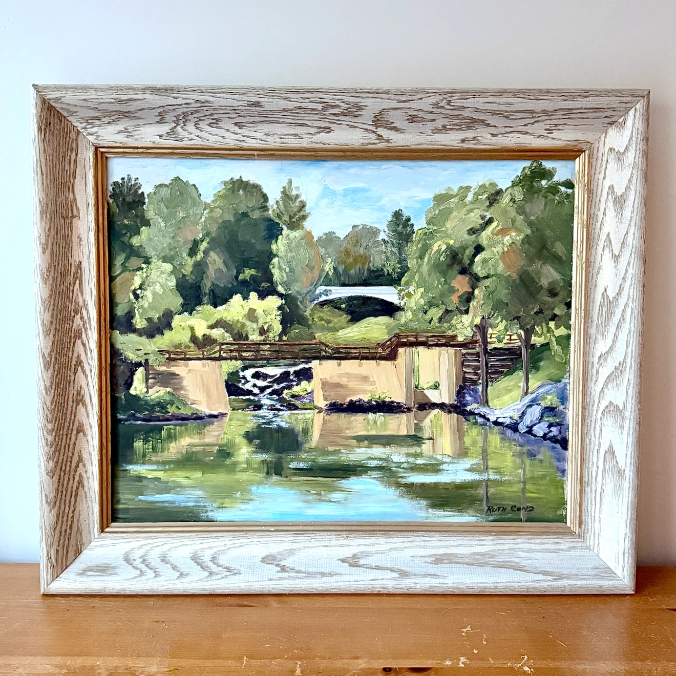 Framed landscape oil painting on board
