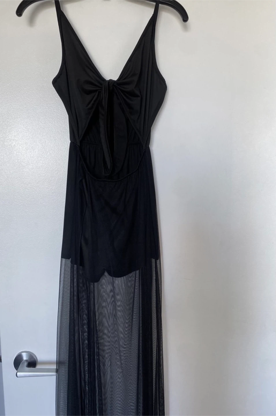 Black sleeveless romper with sheer skirt
