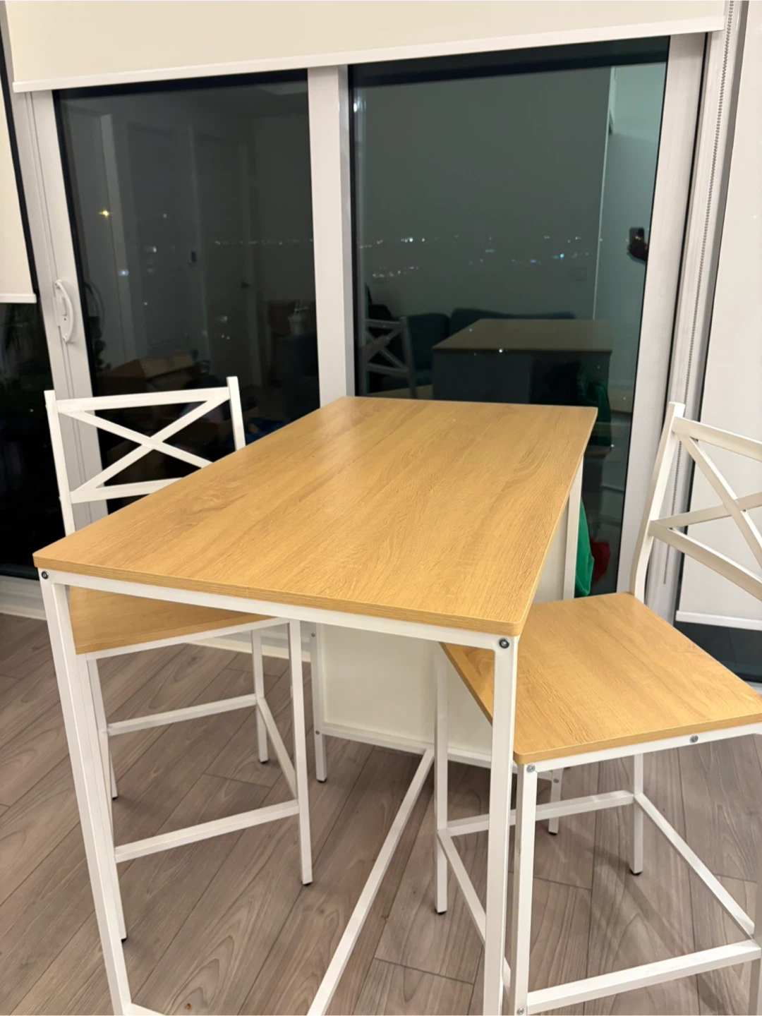 Wooden counter height table with two chairs