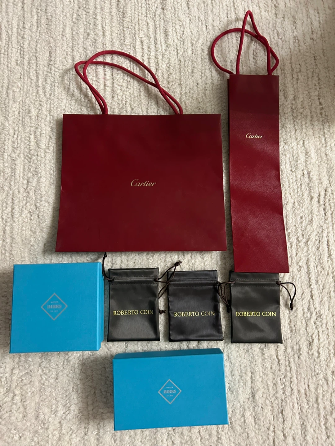 Cartier and Birks boxes & Roberto Coin Pouches