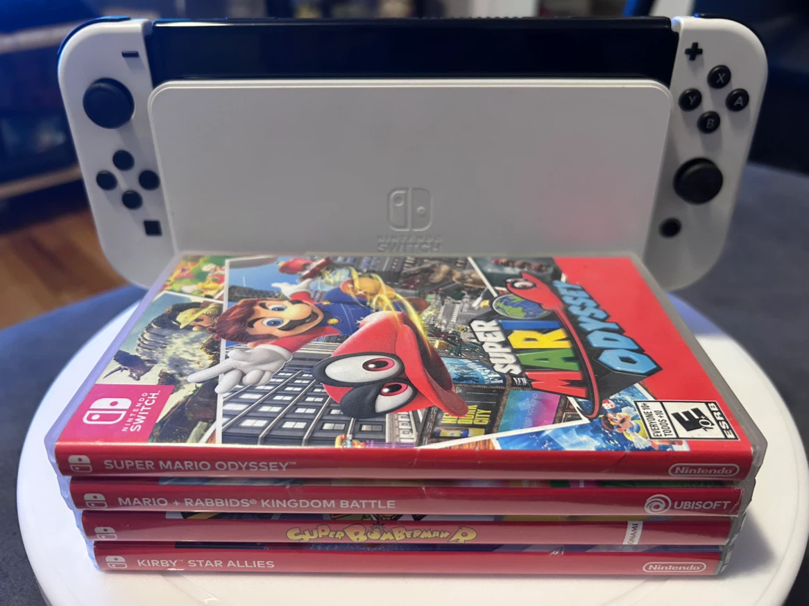 Nintendo Switch OLED with four games