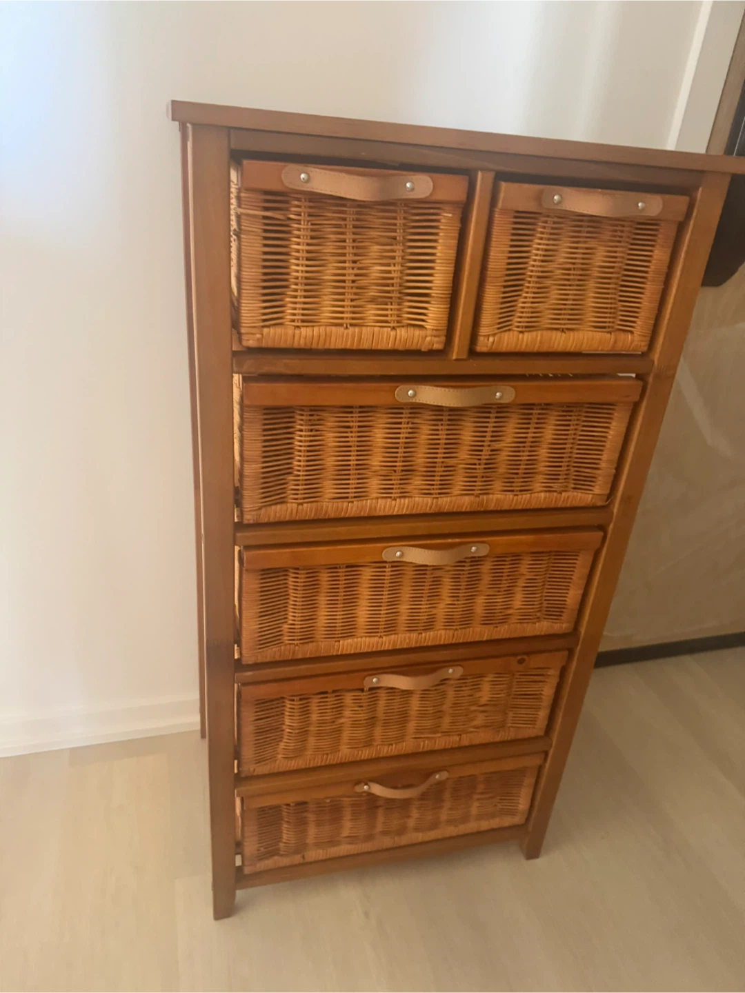 Wooden dresser with wicker drawers