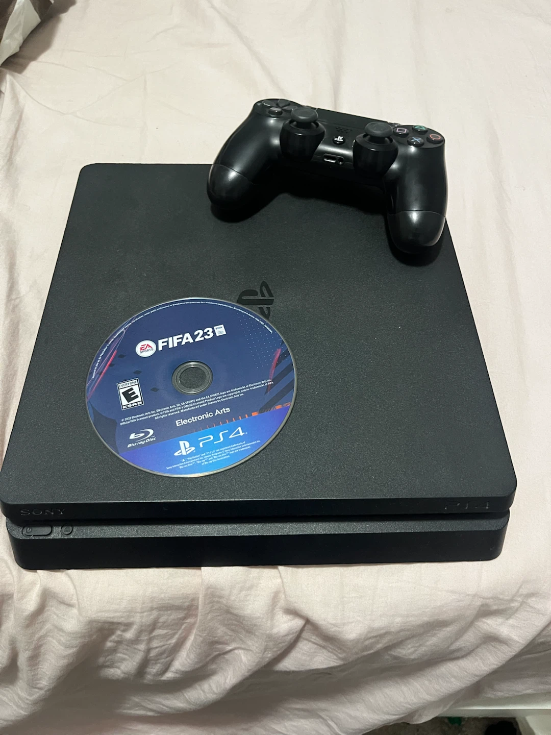 PlayStation 4 Slim Console with FIFA 23 Game and Controller
