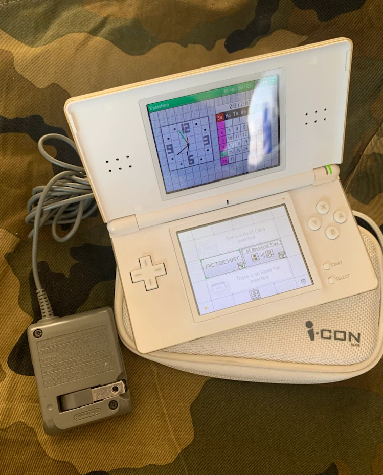 Nintendo DS Lite with Case, stylus  and R4 Revolution Card