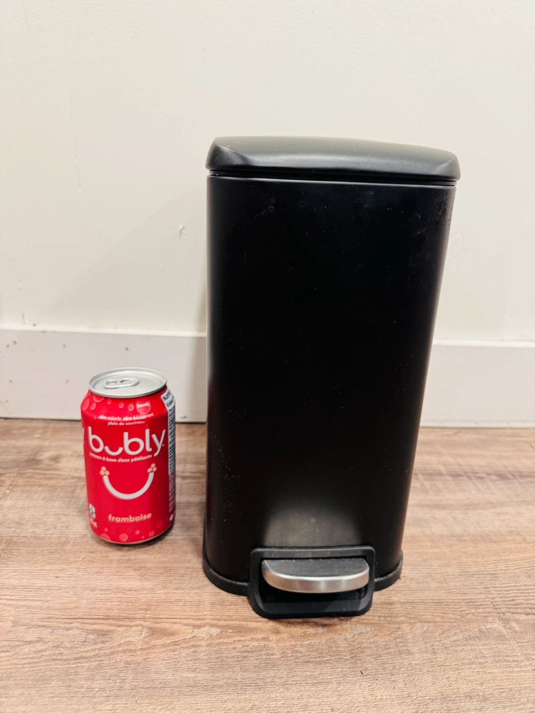 Small black step trash can