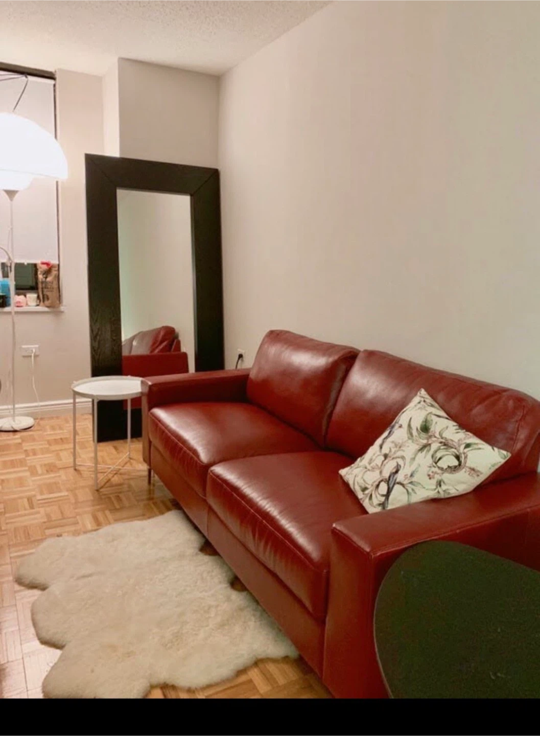Burgundy red leather sofa
