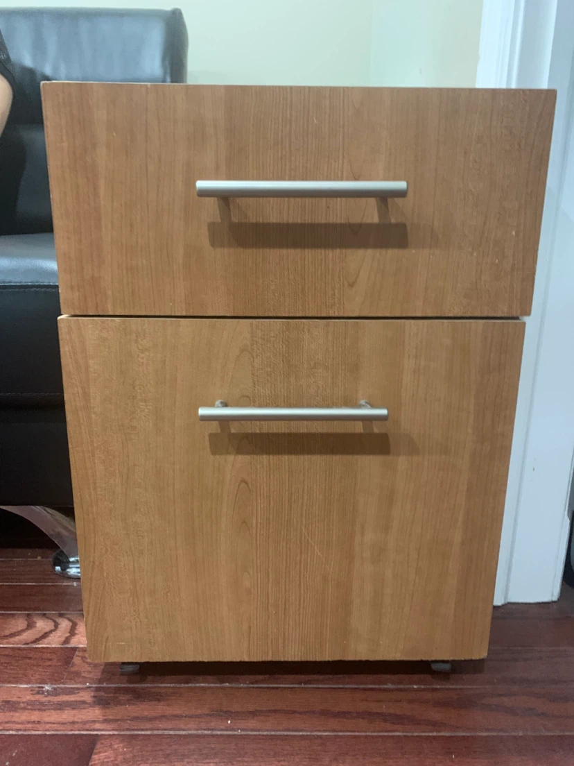 A small cabinet with wheels