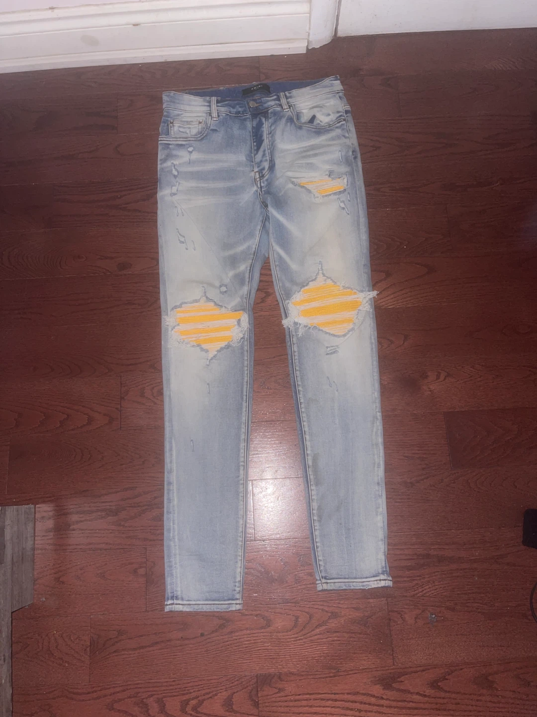 Blue yellow rip Amiri jeans