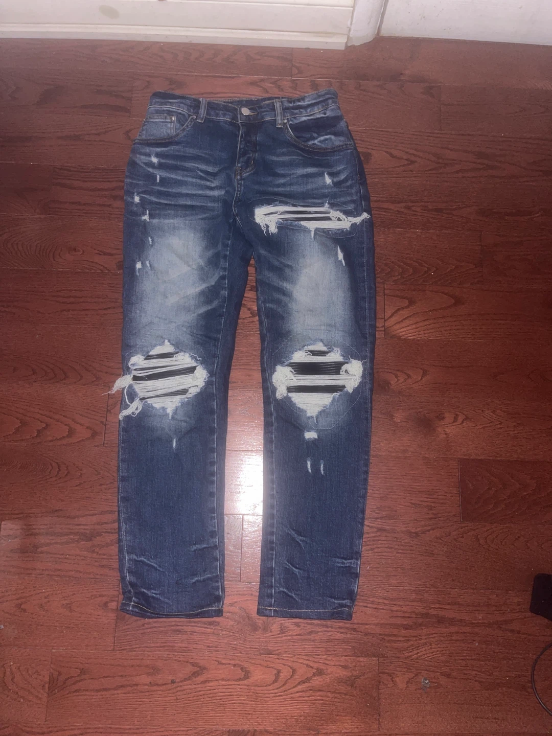 Amiri Distressed Denim Jeans in Blue size 33