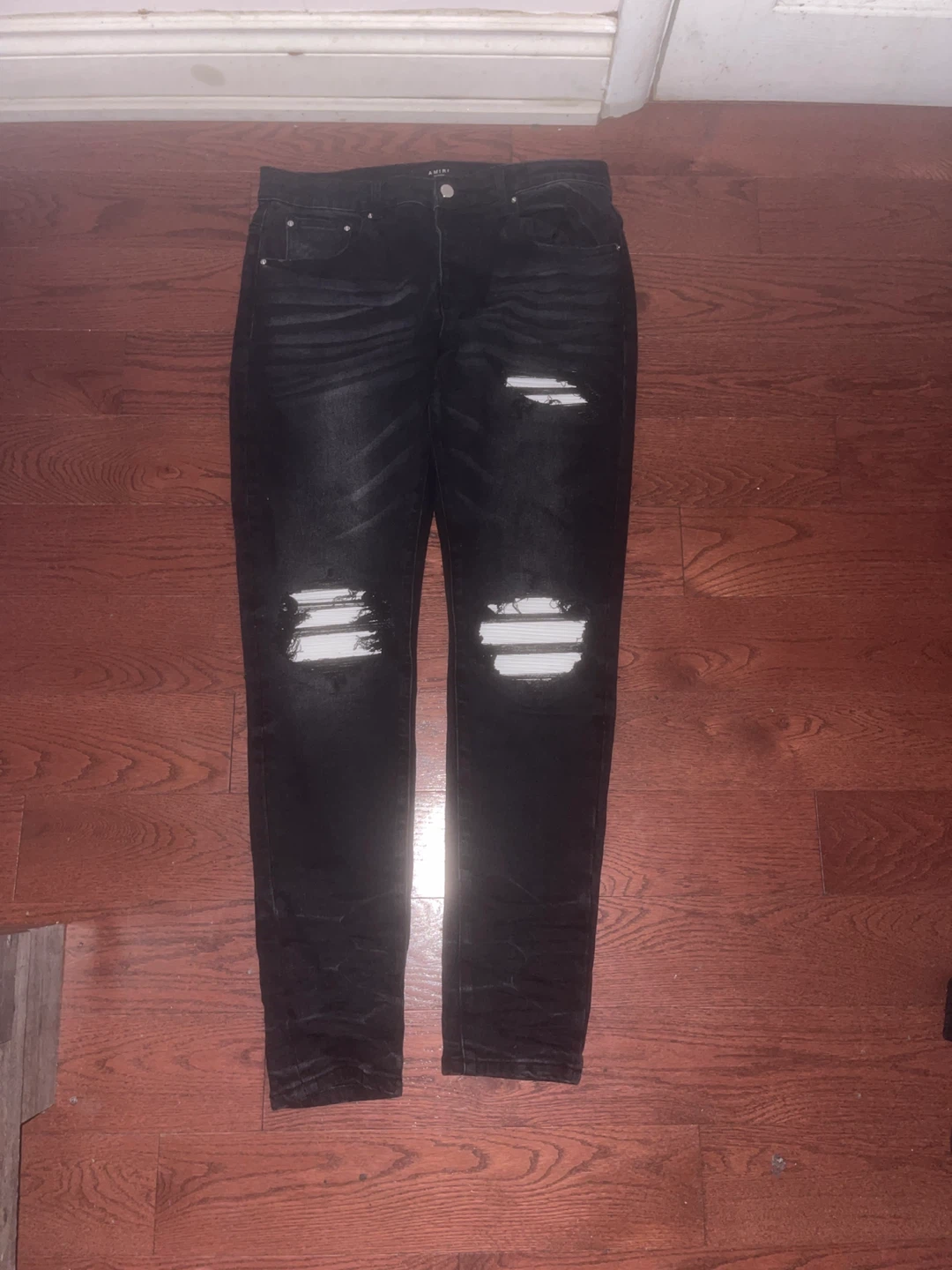 Amiri distressed black and white rips jeans