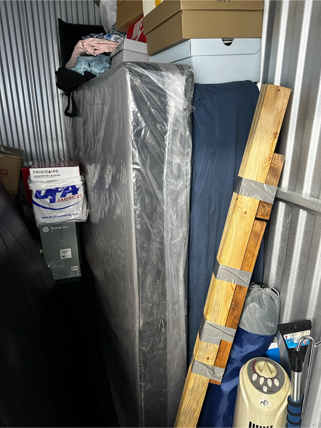 Black headboard and bed frame parts and mattress