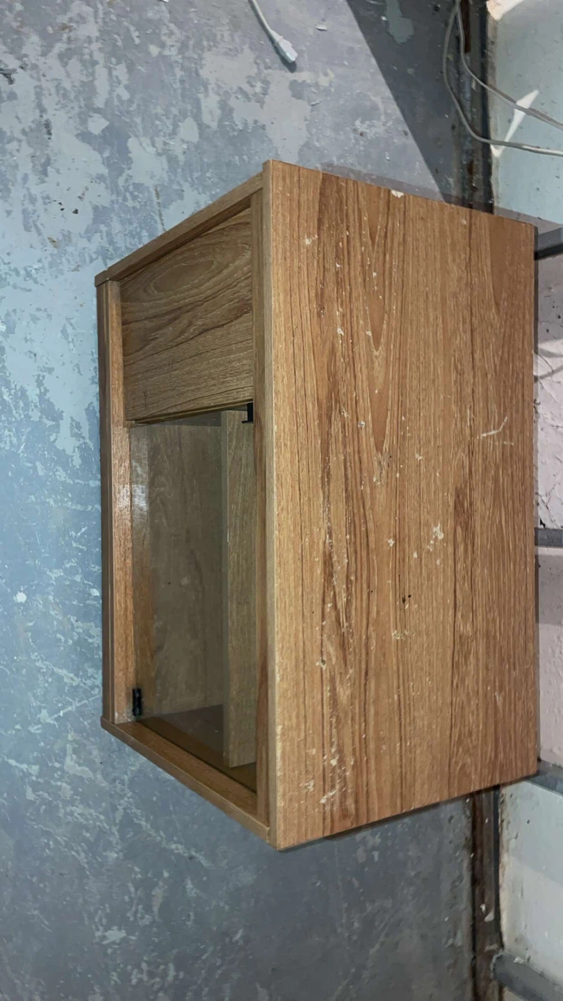 Wooden TV stand with glass door It has wheels too