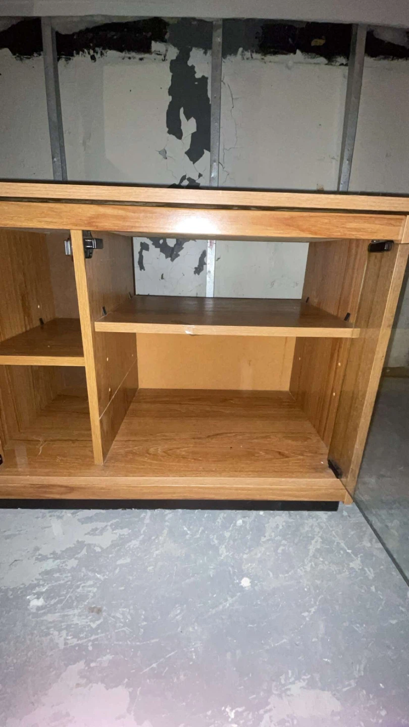 Wooden TV stand with glass door It has wheels too - photo 3