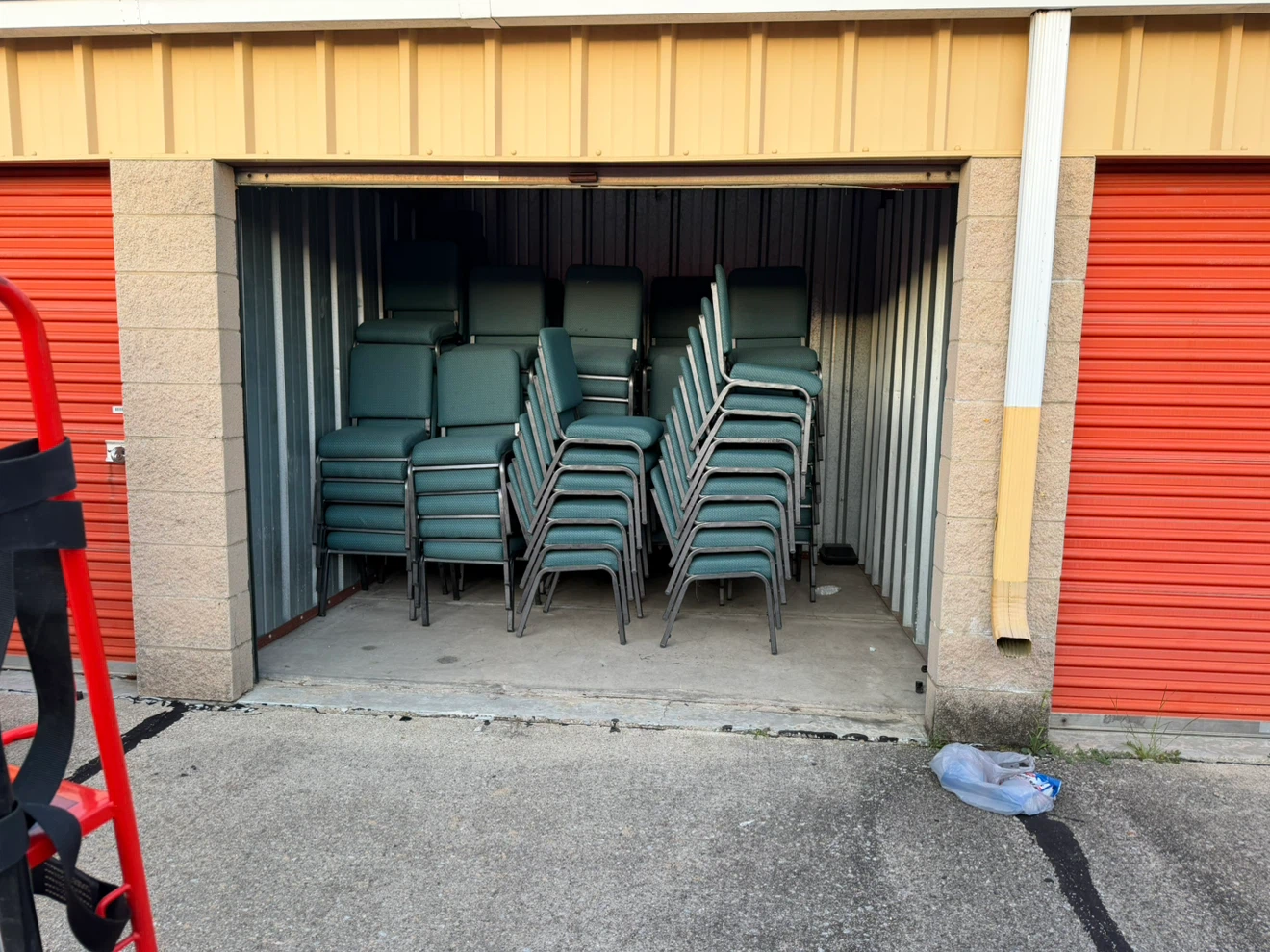 Stackable padded chairs in dark green