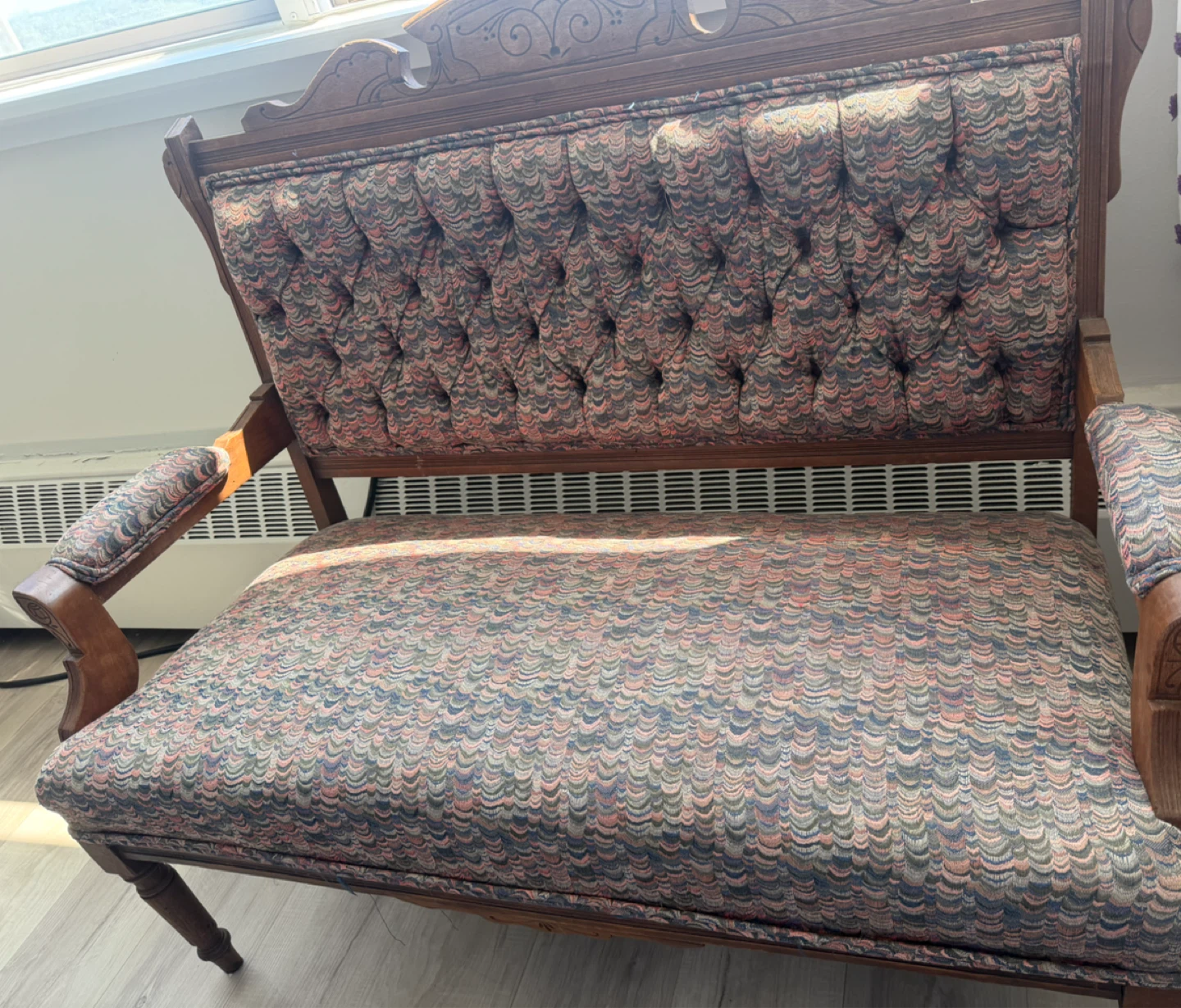 Vintage carved wood settee with tufted upholstery