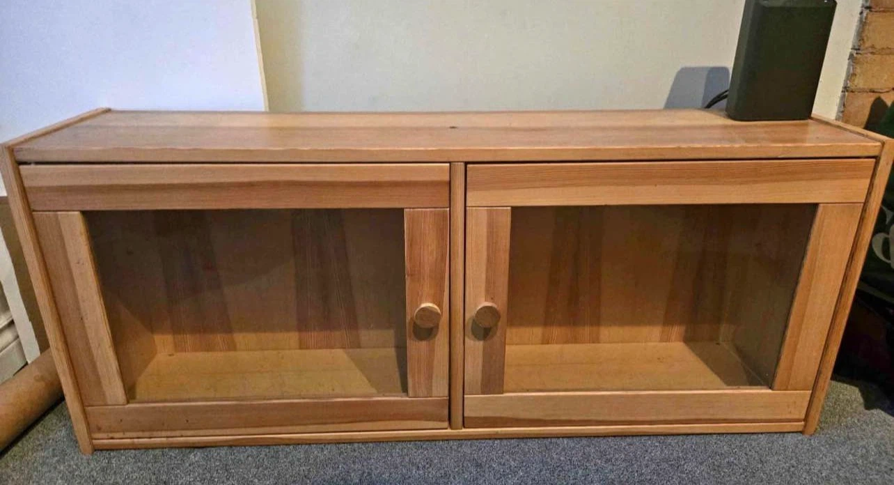 Wood media cabinet with glass doors