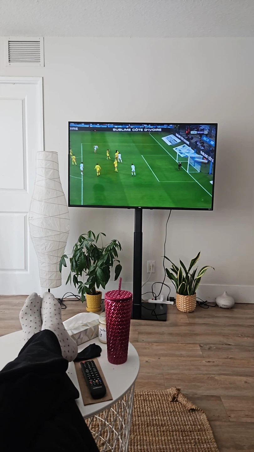 RCA 55” 4K UHD Roku Smart TV + Adjustable TV Stand