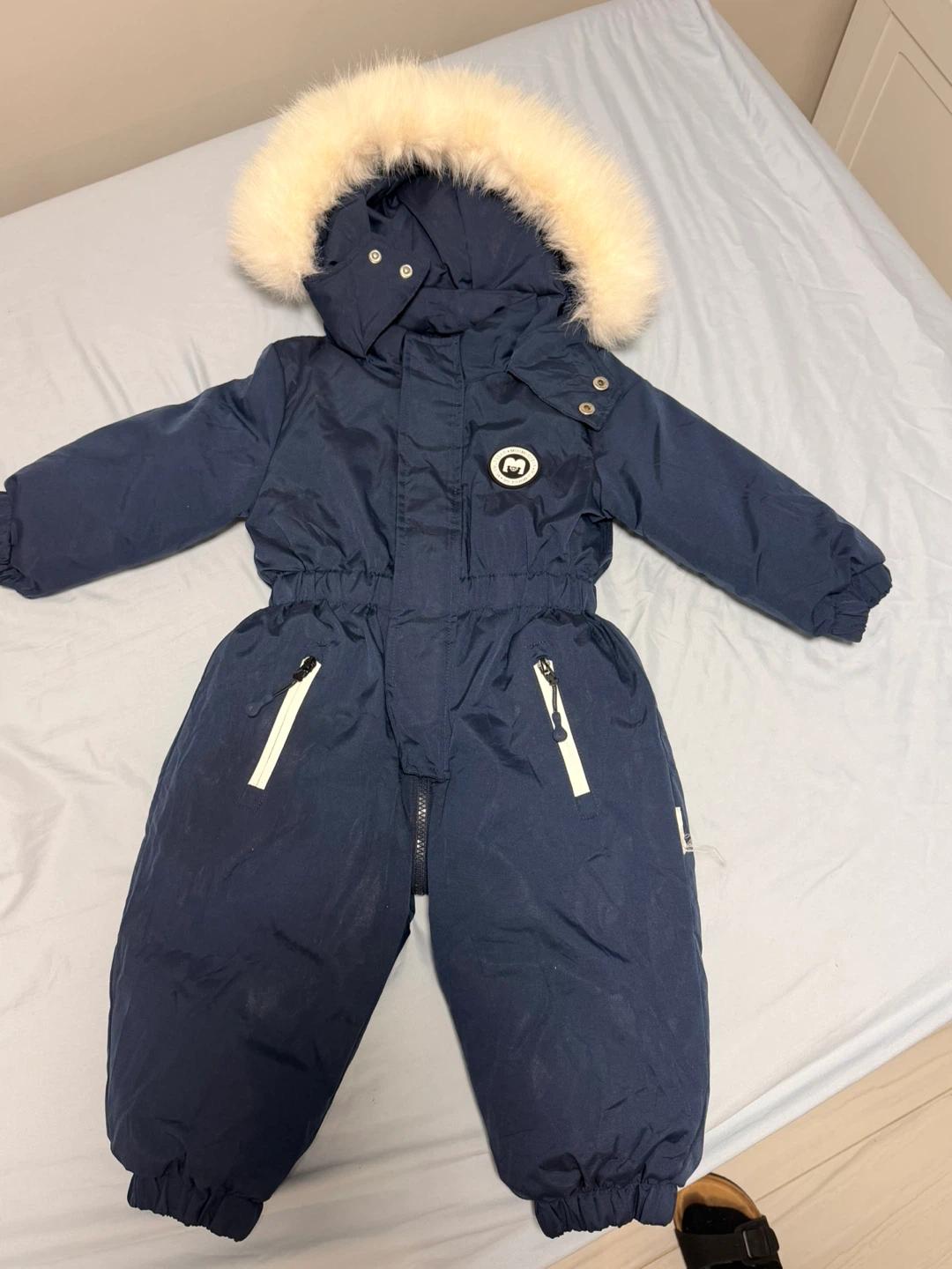Navy blue winter snowsuit with faux fur hood