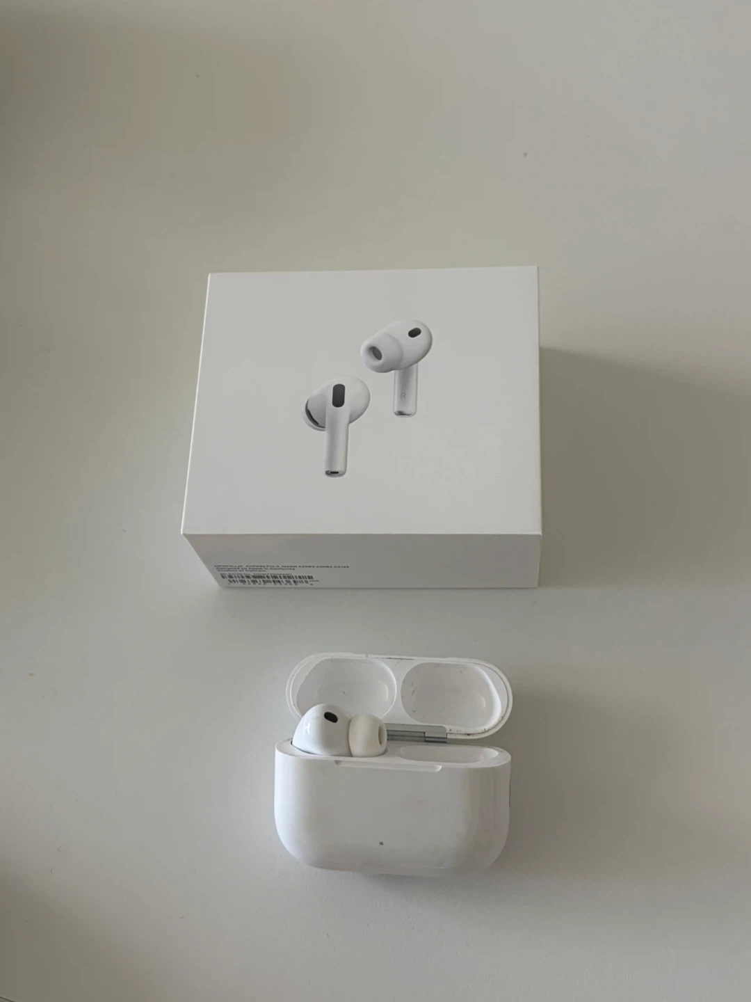 AirPods Pro (latest model) — Left Earbud + Charging Case