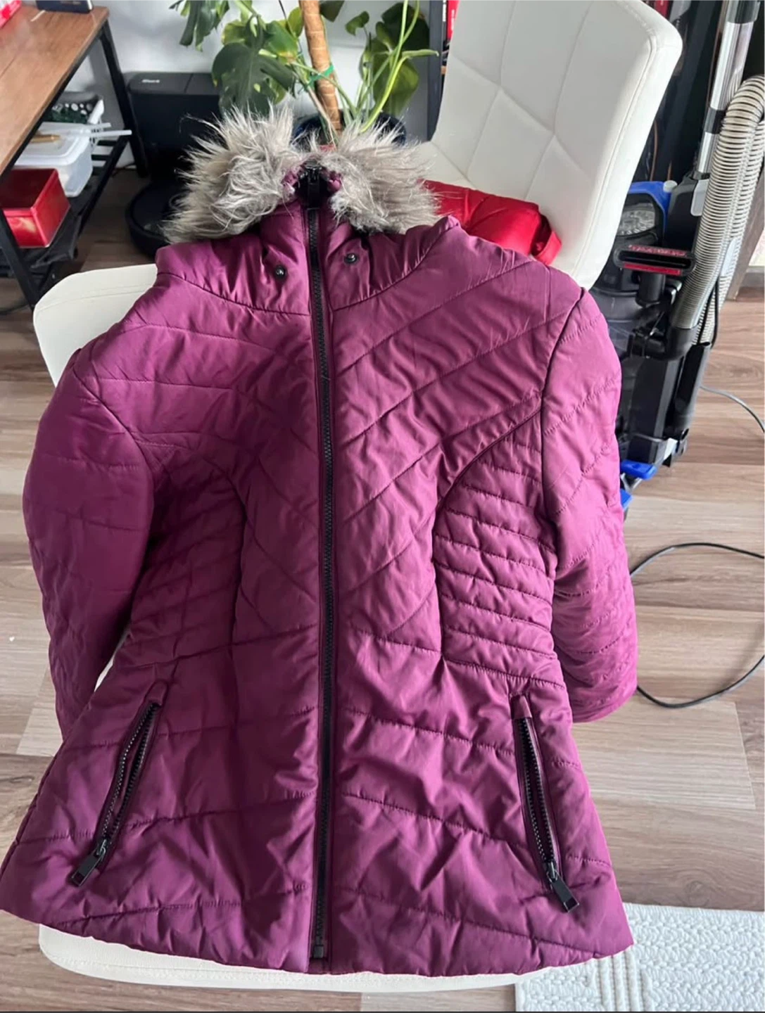 Purple quilted puffer jacket with faux fur hood