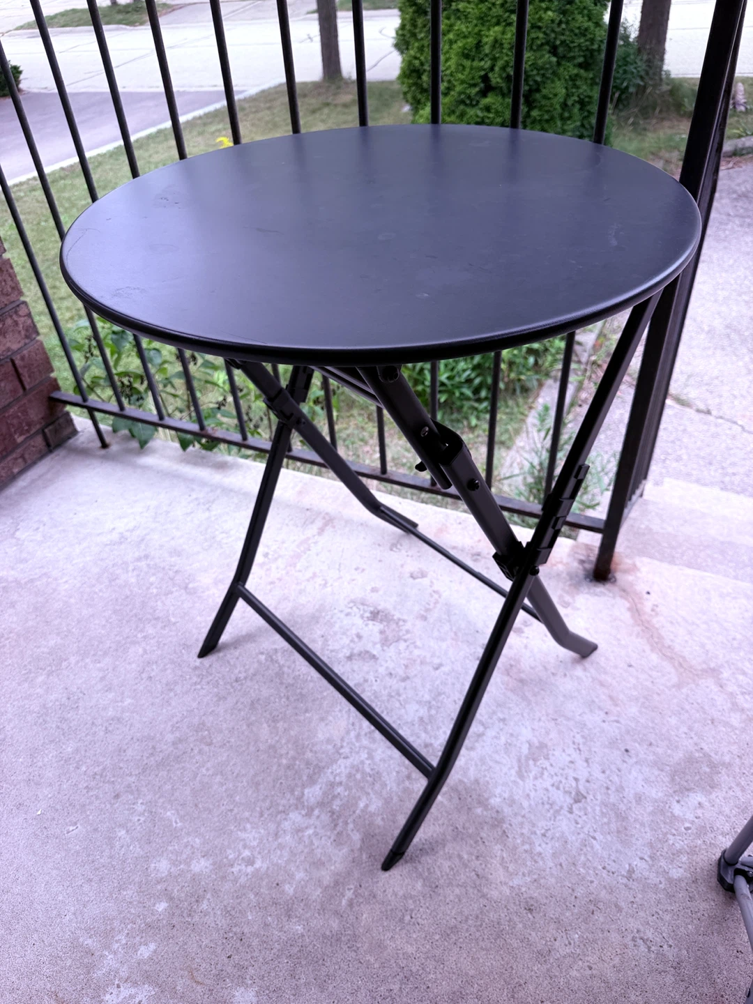 Black round folding bistro table