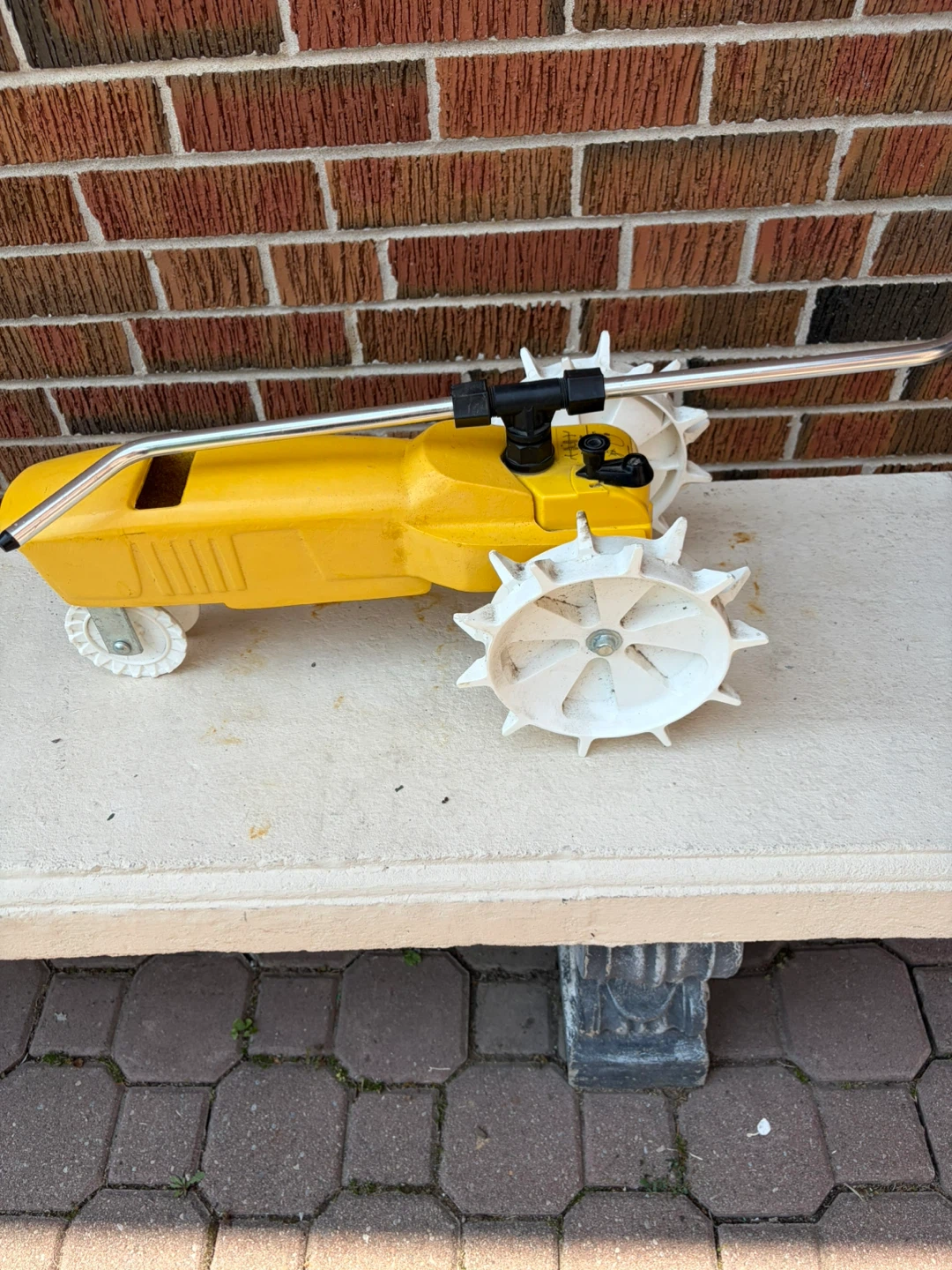 Yellow Traveling Lawn Sprinkler cast  iron